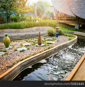 Beautiful Water pond in the garden classic round design for fish pond with fountain flow for oxygen nature
