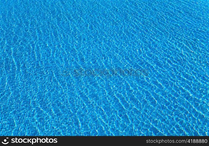 Beautiful water surface in pool against a mosaic.