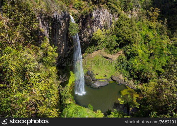 beautiful waterfall in green rainforest, New Zealand