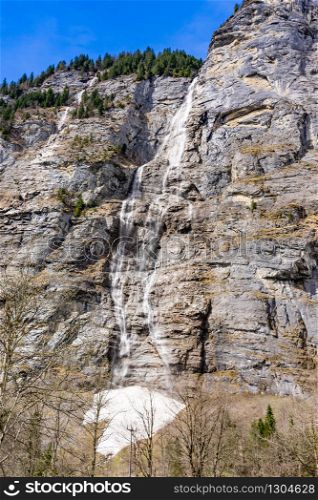 Beautiful waterfall in Lauterbrunnen swiss village, , Bernese Oberland, Switzerland, Europe