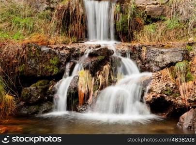 Beautiful waterfall in the forest during autumn