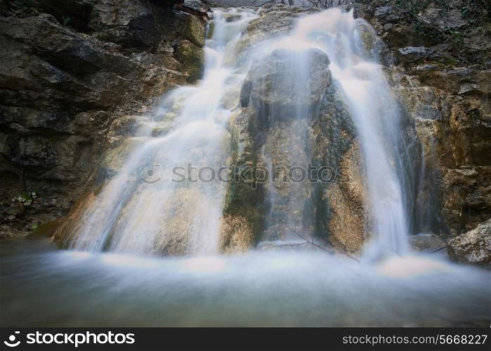 Beautiful waterfall in the forest. Water motion.