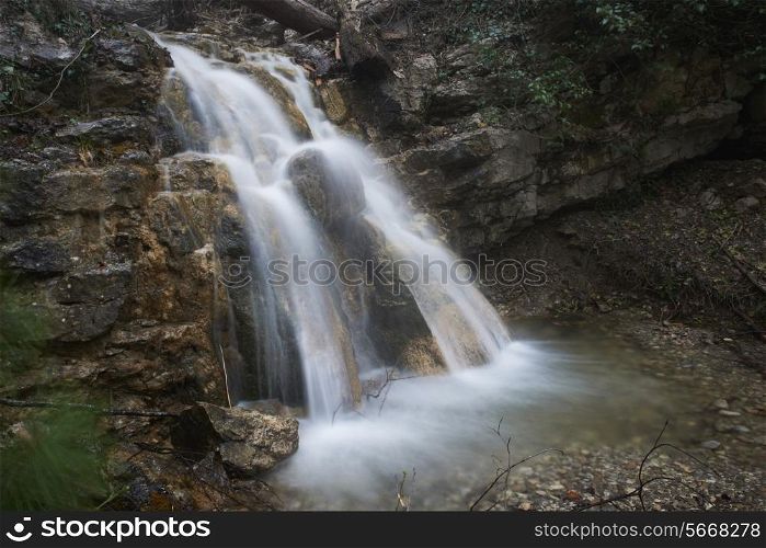 Beautiful waterfall in the forest. Water motion.