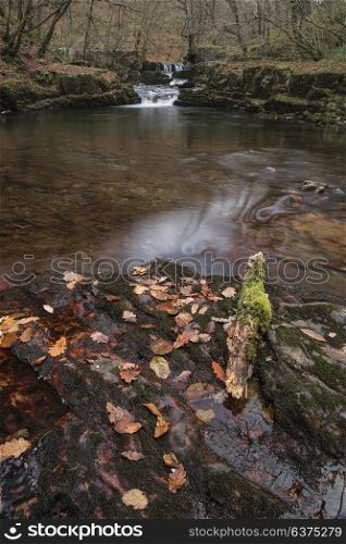 Beautiful waterfall landscape image in forest during Autumn Fall