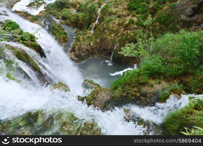 beautiful waterfalls on slopes of mountains