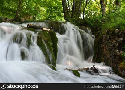 beautiful waterfalls on slopes of mountains