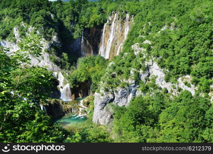 beautiful waterfalls on slopes of mountains