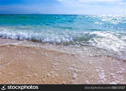 Beautiful wave blue breaking empty sandy beach daytime. Beautiful wave breaking empty beach