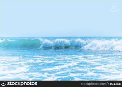 Beautiful waves in sea. Beautiful tropical sea waves under clear blue sky