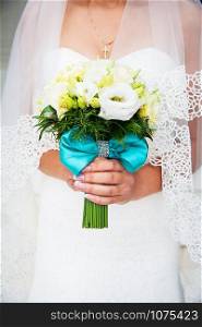 Beautiful wedding bouquet in hands of the bride. Beautiful wedding bouquet in hands of bride
