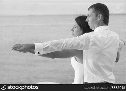 Beautiful wedding couple- bride and groom at the beach. Black and white
