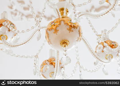 Beautiful white and gold crystal chandelier close up