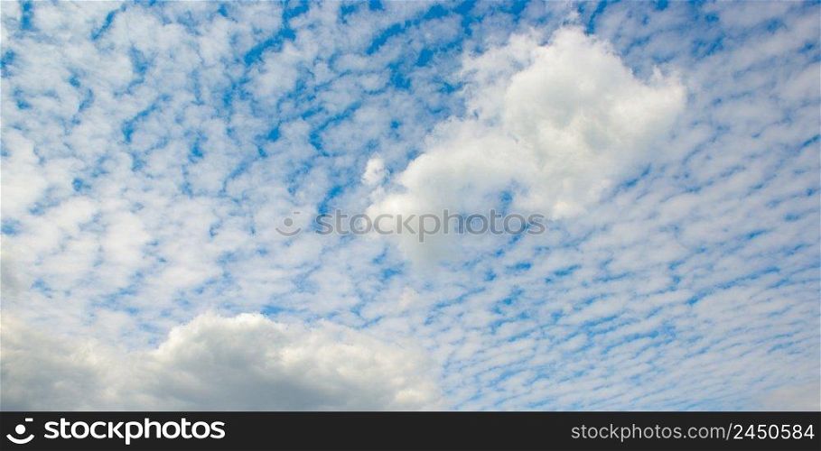 Beautiful white cirrus clouds on blue sky. Panorama