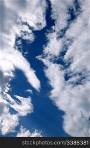 beautiful white clouds on a background of the blue sky