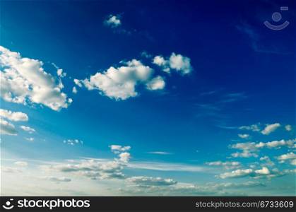 beautiful white clouds on a background of the blue sky