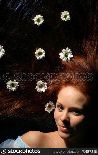 beautiful white flowers in girl hair