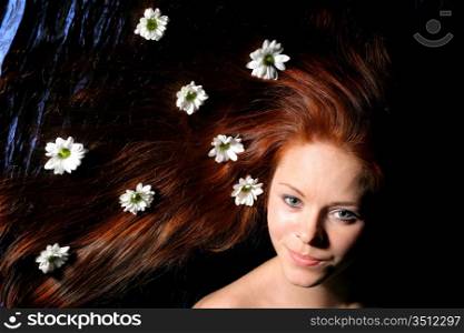 beautiful white flowers in girl hair