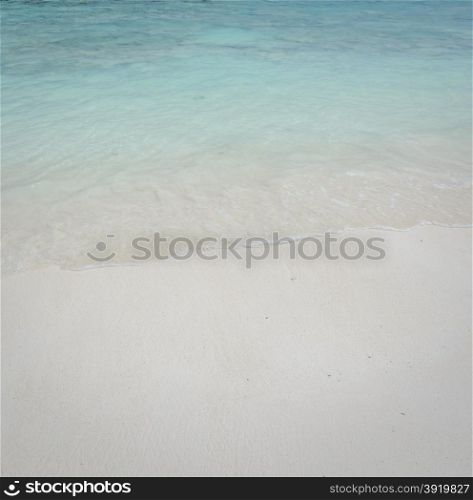 Beautiful white sand beach and crystal clear water for nature background