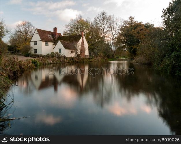 beautiful willy lotts cottage autumn long exposure blurred water constable country flatford mill; suffolk; england; uk