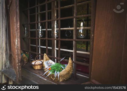 Beautiful window decor in a wooden house.