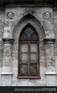 Beautiful window in the wall of a Gothic church