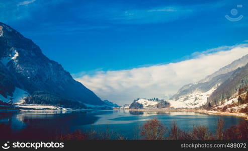 Beautiful winter lake and snowy mountains. Winter landscape