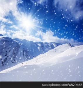Beautiful winter landscape, high mountains covered with white snow, frosty sunny day, snowy weather, luxury ski resort