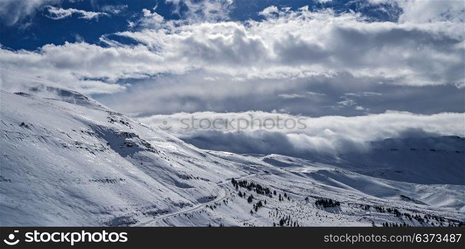 Beautiful winter landscape, high mountains covered with white snow on bright sunny day, Cedars Mountains, Lebanon
