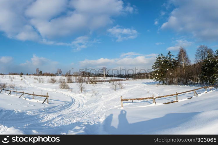 Beautiful winter landscape in a sunny frosty day in central Russia.