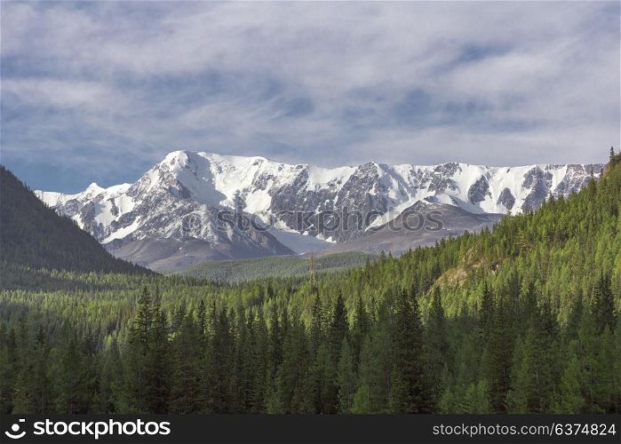 Beautiful winter landscape with snow covered mountain peaks. Beautiful winter landscape with snow covered mountain peaks.