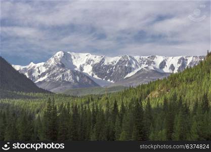 Beautiful winter landscape with snow covered mountain peaks. Beautiful winter landscape with snow covered mountain peaks.