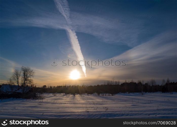 Beautiful winter sunset with a cloudy sky in February evening, Russia.