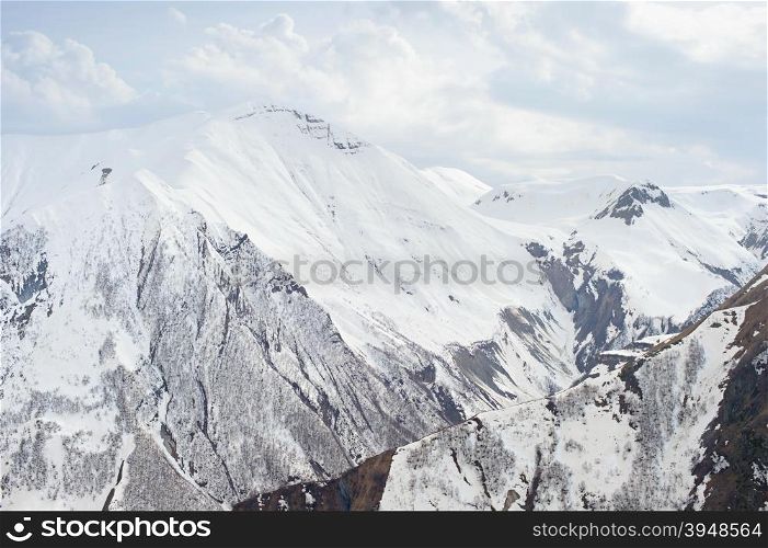 Beautiful winter view of Caucasus mountains in the day. Georgian republic