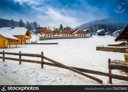 Beautiful winter view of farm on mountain at Austrian town