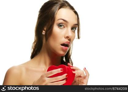 beautiful woman about to open a red heart shaped box. beautiful woman about to open a red heart shaped box on white background