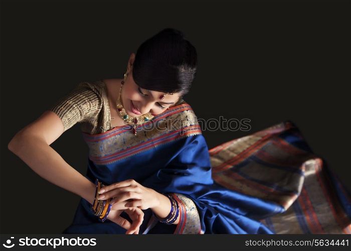 Beautiful woman admiring her bangles