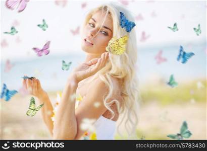 Beautiful woman among hundreds colorful butterflies