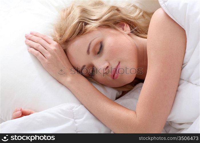 Beautiful woman asleep in bed