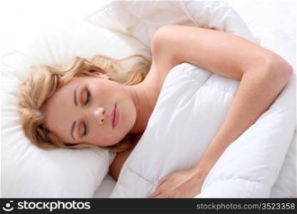 Beautiful woman asleep in bed