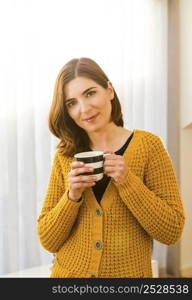 Beautiful woman at home drinking a coffee