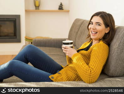 Beautiful woman at home Having a good time with cup a coffee