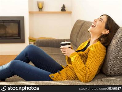 Beautiful woman at home Having a good time with cup a coffee