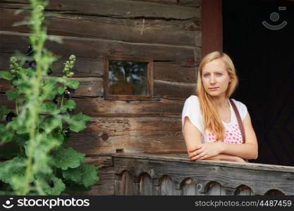 beautiful woman at porch wooden house