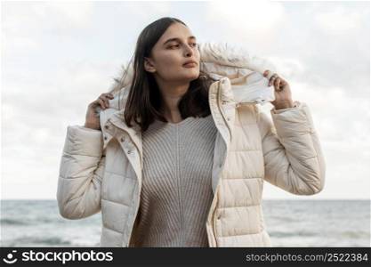 beautiful woman beach with winter jacket
