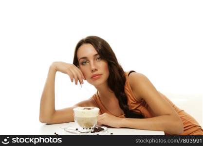 beautiful woman bending over cappuccino on a table. beautiful woman bending over cappuccino on a table on white background