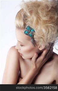 Beautiful woman blonde hair model touching her face