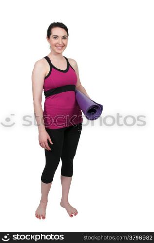 Beautiful woman carrying a yoga mat before exercising