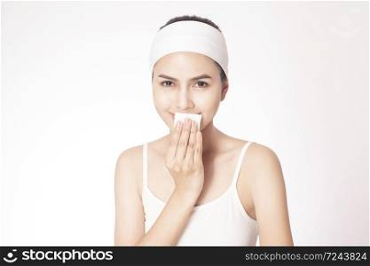 beautiful woman cleansing her face