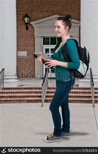 Beautiful woman college student with a backpack or book bag