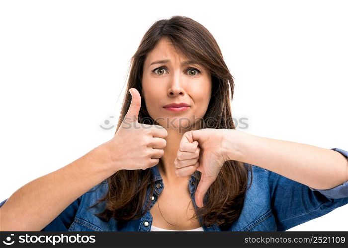 Beautiful woman confused making thumbs up and down. Up and Down